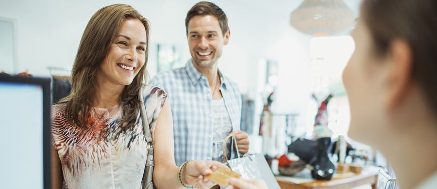 a couple shopping using their credit card