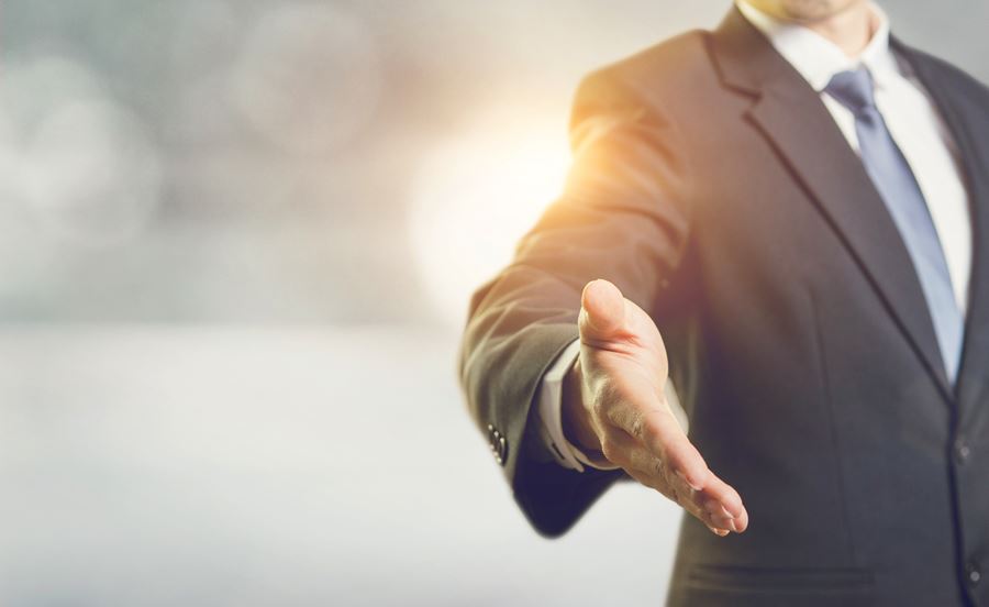 A man extending his hand to shake a hand